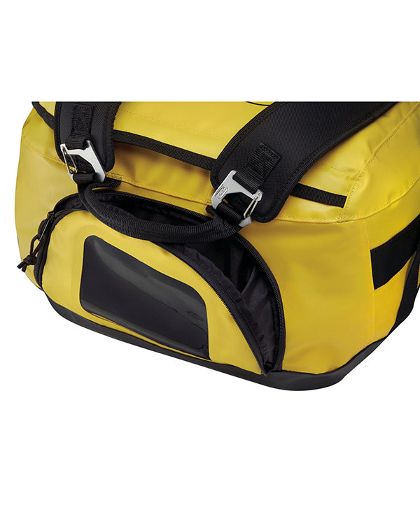 Petzl Duffel 85 Large Capacity Gear Bag – The Petzl Duffel 85 is a versatile, comfortable and practical gear bag with a large 85 liter capacity. The bag can be carried in multiple ways; the padded back shoulder straps make it a comfortable backpack and the removeable shoulder straps are also padded for cushioning when used as a shoulder bag. The Duffel 85 has a large suitcase style opening for easy access to equipment. The bag features a large pocket for a helmet or shoes and two pockets in the inner flap f
