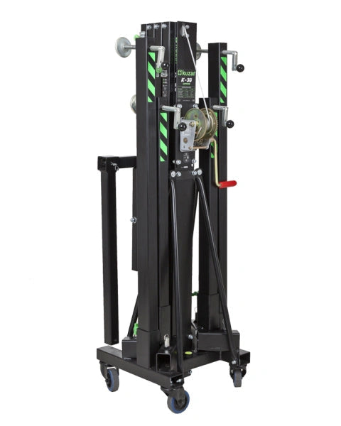 Kuzar Tower Lift K30– Weighing only 103kg the K-30 is capable of lifting 200kg to a height of 5m. The K-30 is a multipurpose tower for the elevation of Audio Systems, Line Array, truss structures, lighting systems, etc. The K-30 lifting tower is the lightest in the range. It is composed of 4 aluminum sections and a steel base provides stability, it comes with two extra lateral supports to provide more muscle when lifting P.A. In addition to four adjustable legs with non-slip rubber saucers. The 4 swivel whe